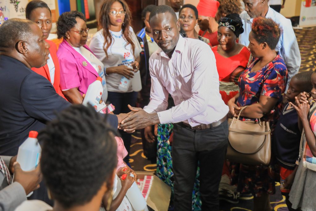 BOARD OF DIRECTORS GIVING SICKLE CELL PATIENTS BOTTLES AND MEDICINE
